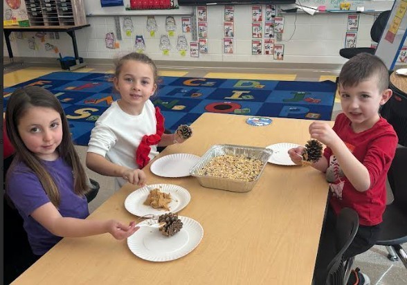 students with birdfeeders