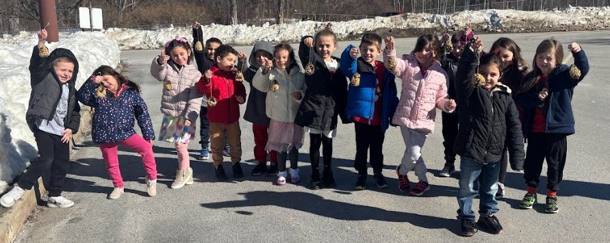 students with birdfeeders