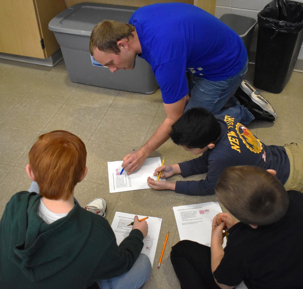 teacher with math students 