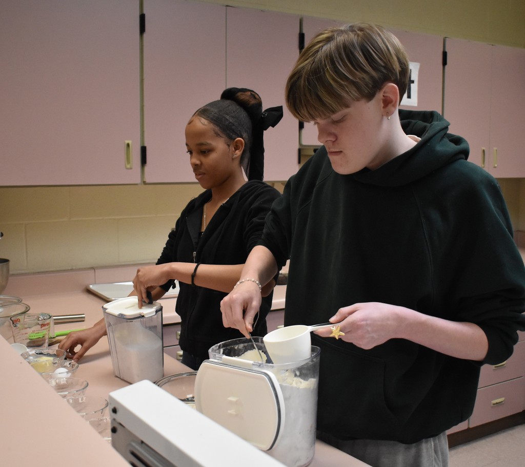 student baking bread