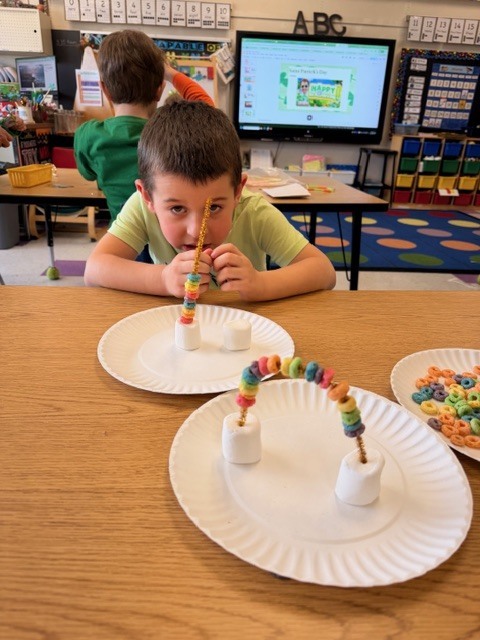 student makiing craft