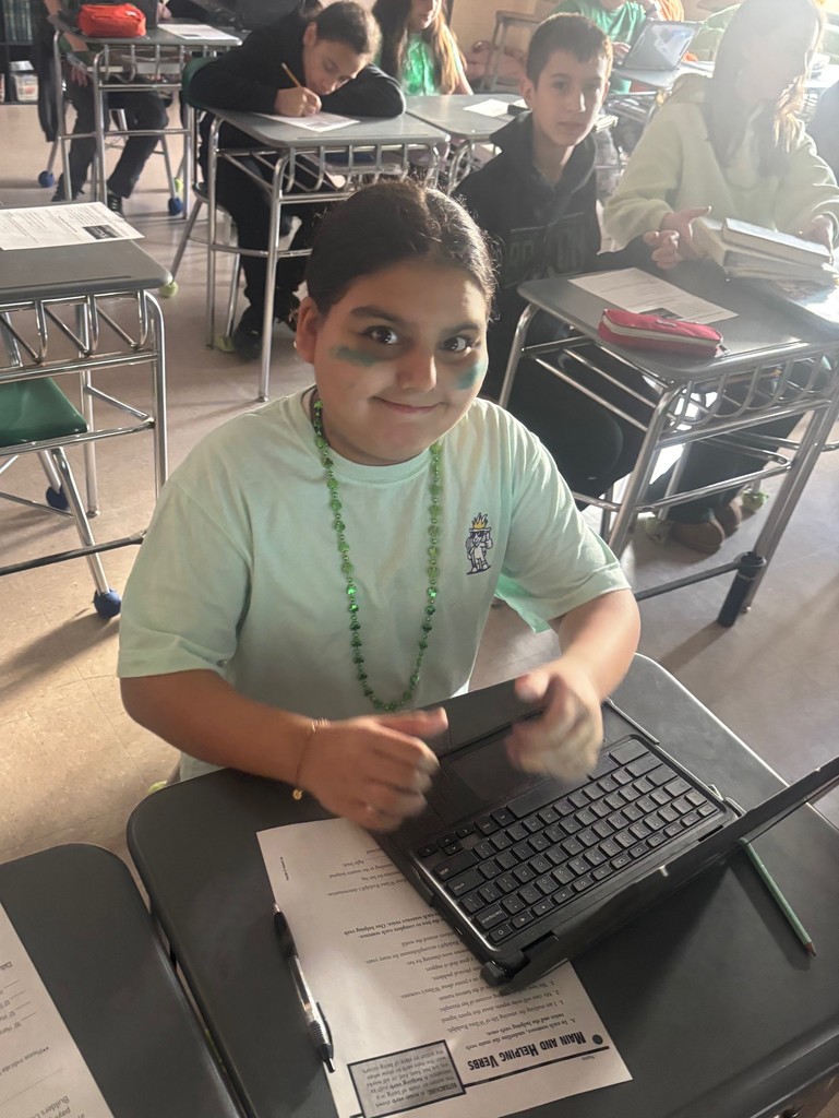 student in green attire