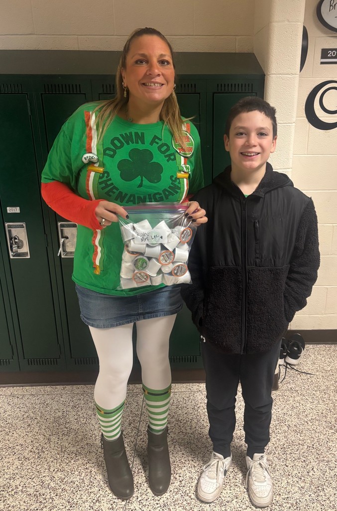 teacher and student in green attire