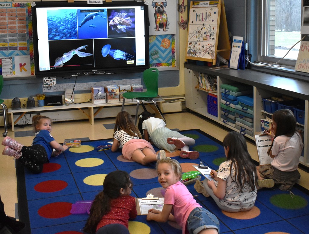 students in class with artwork