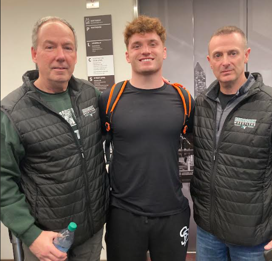 wrestler and coaches