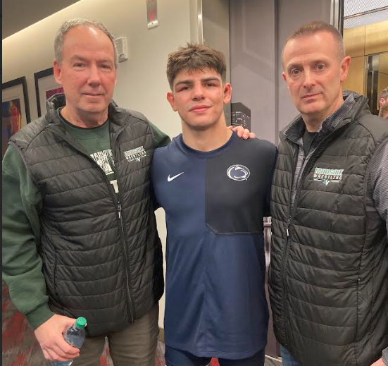 wrestler and coaches