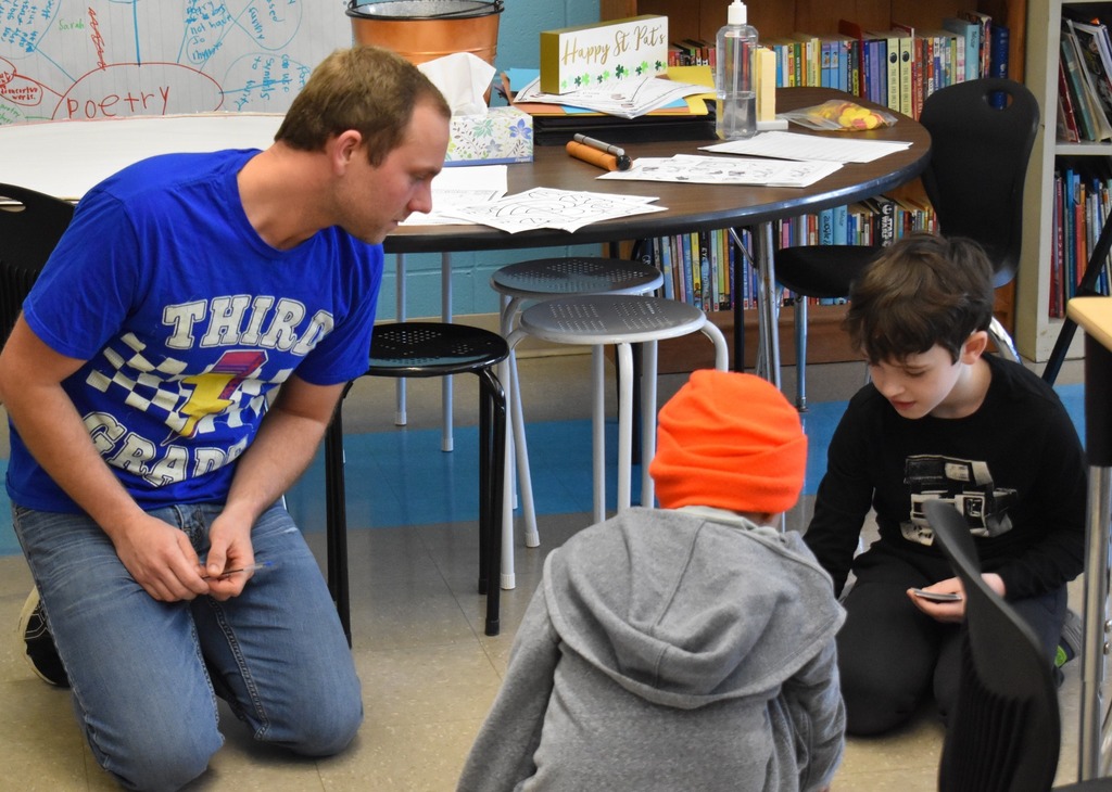 teacher with student in class