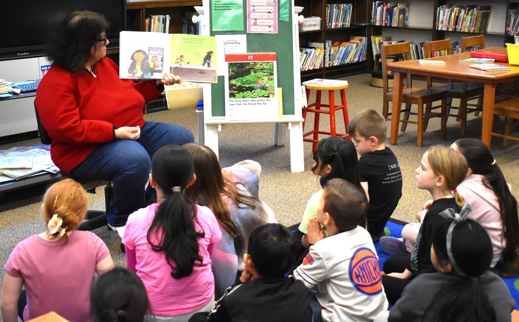 teacher reading to students