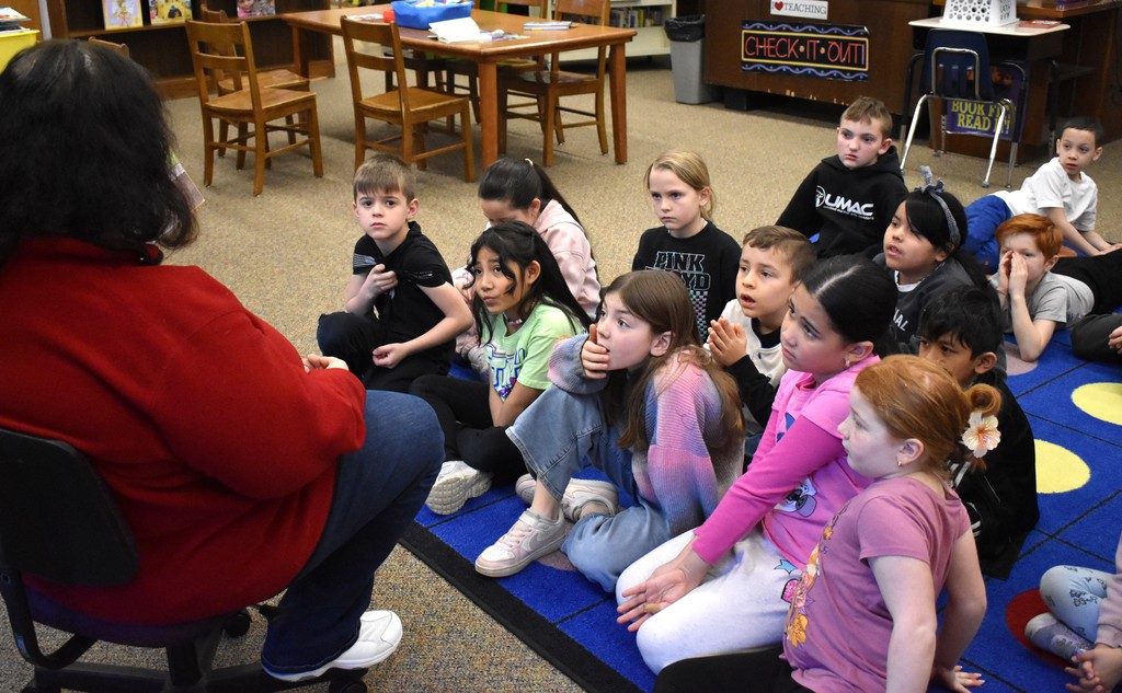 teacher reading to students