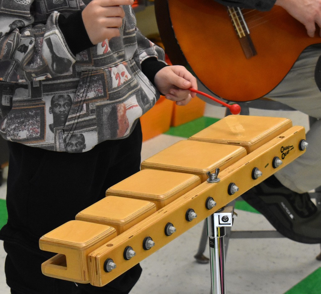 student in music class