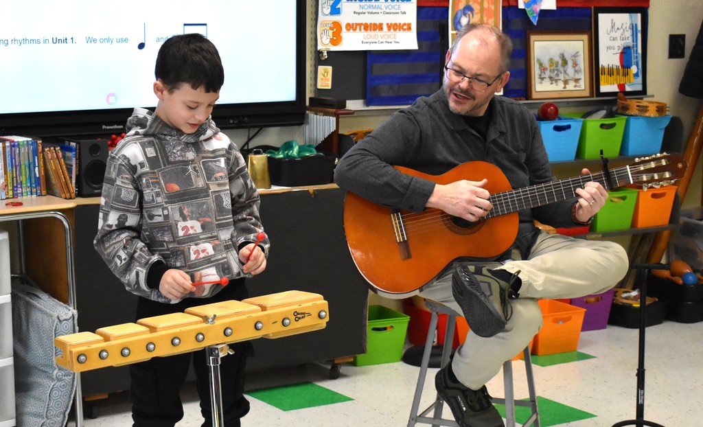 student in music class