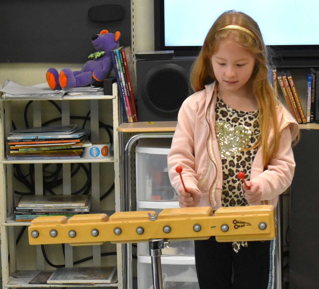 student in music class