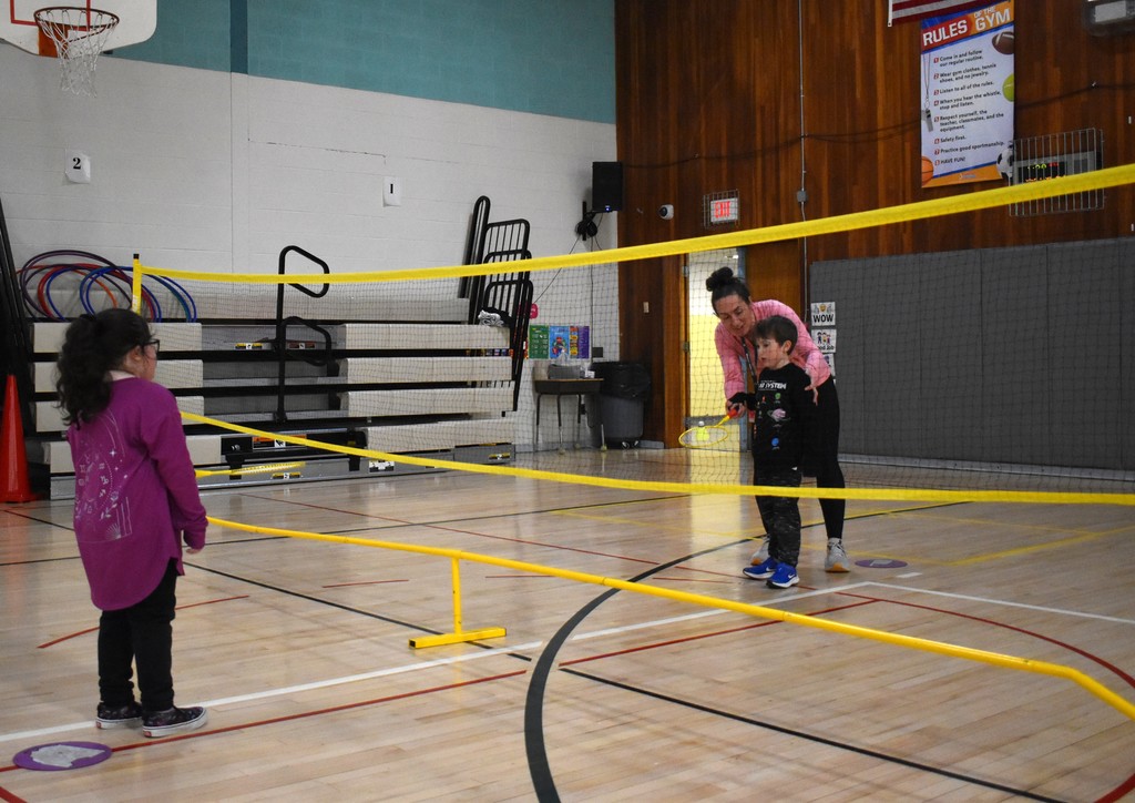 students and teacher in physical education class 