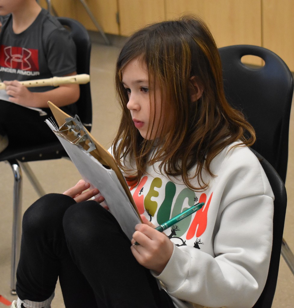 student in music class