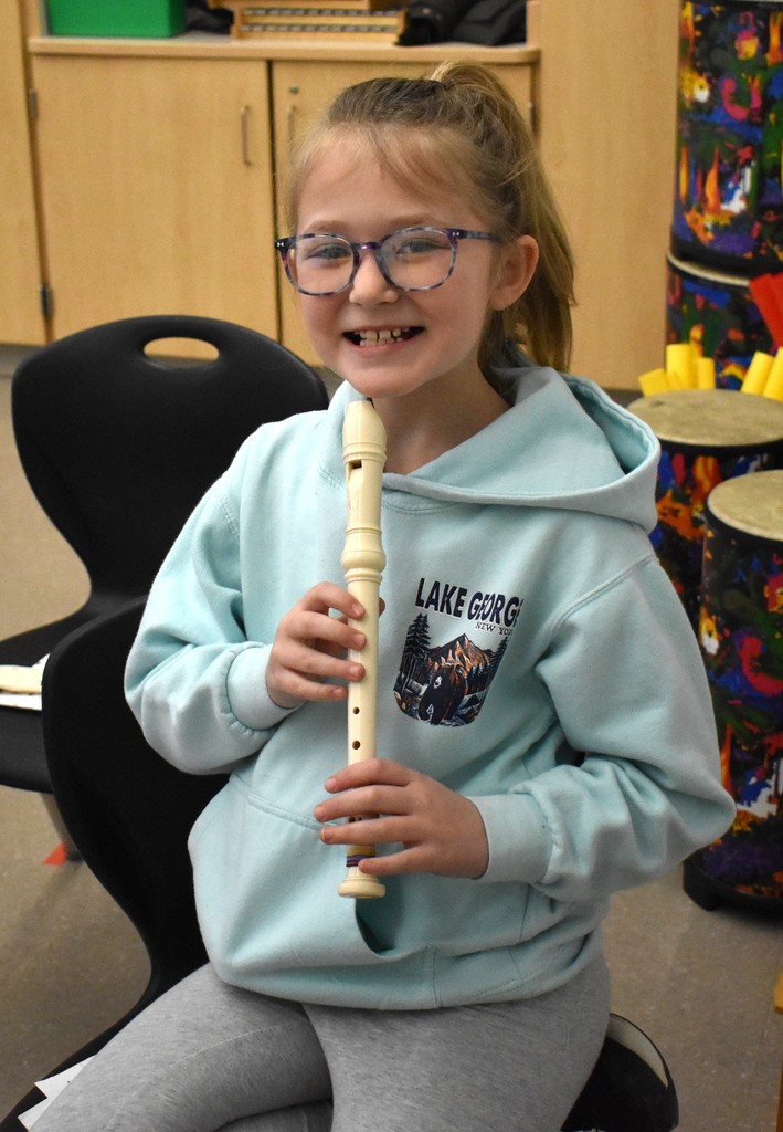 student in music class