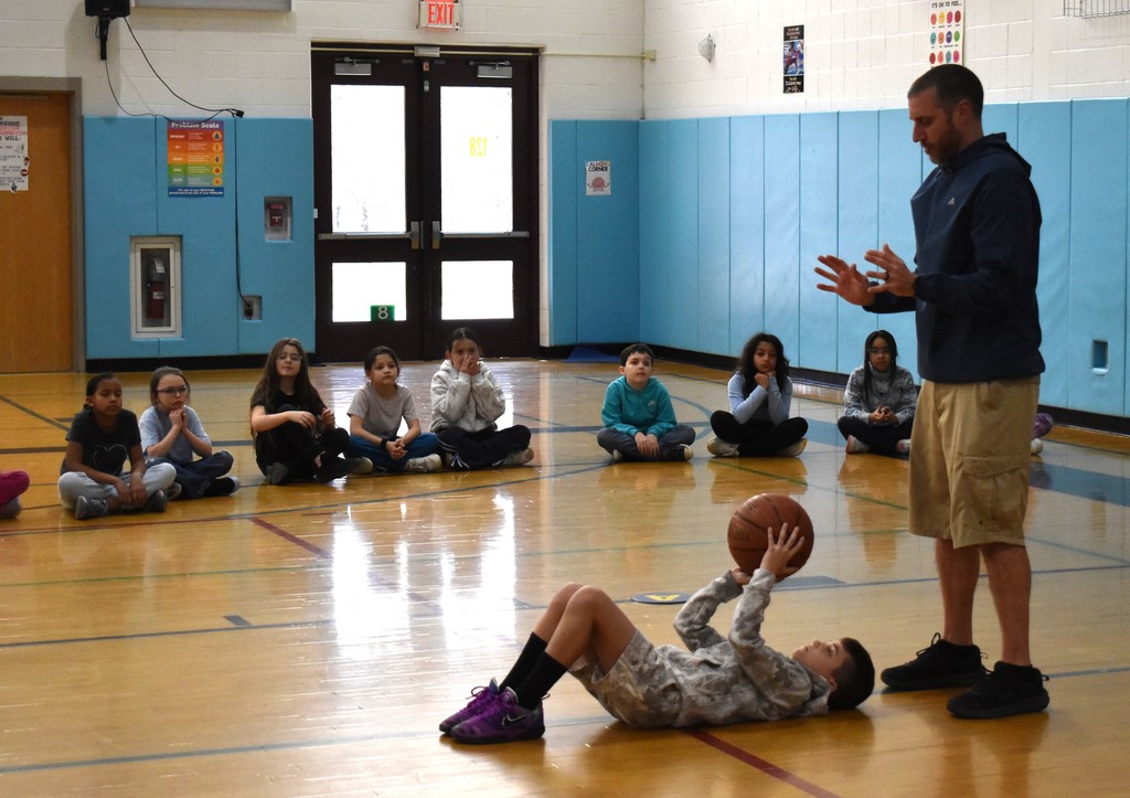 teacher and students in physical education class