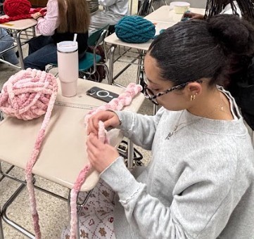 student making scarf