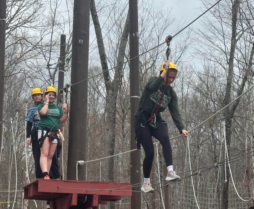 flag football team on ropes course