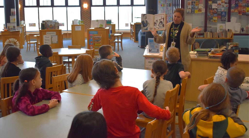 teacher reading to students