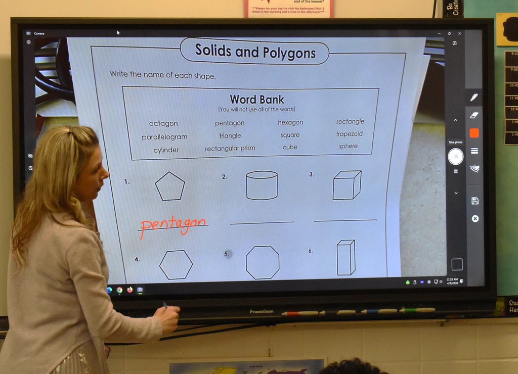 teacher at smartboard