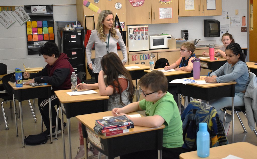 student and teacher in class