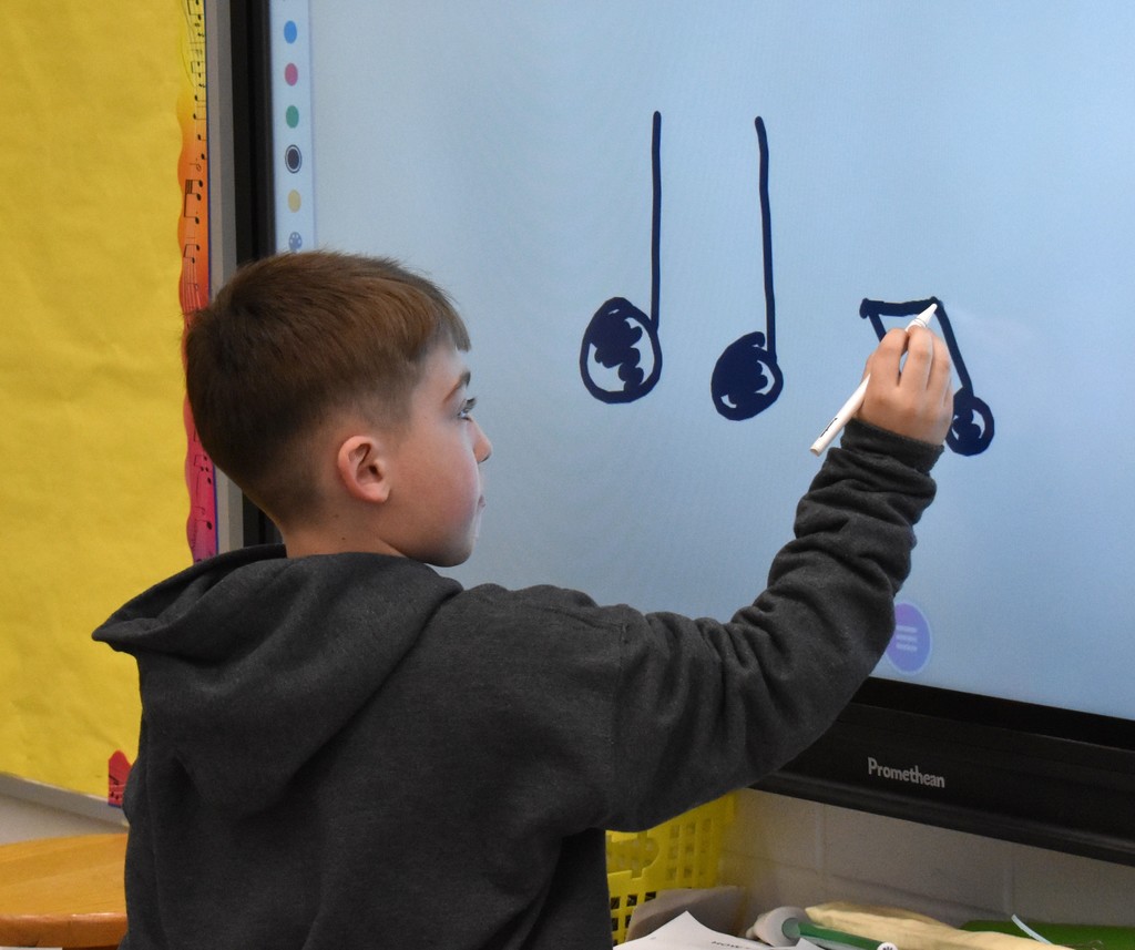 student at white board