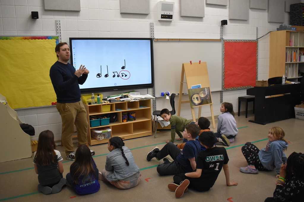 teacher and music students in class