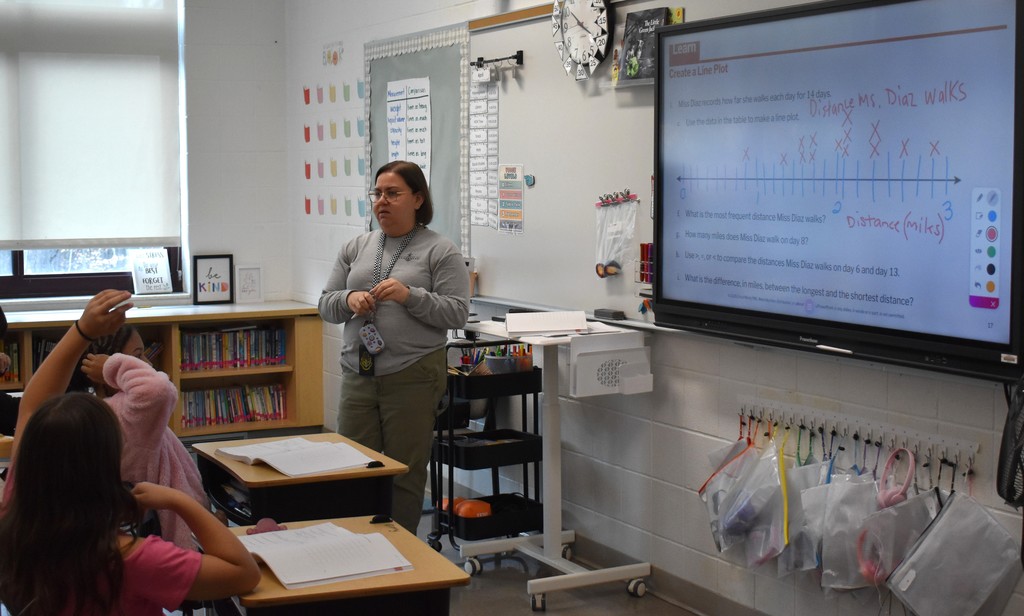 teacher and student in math class