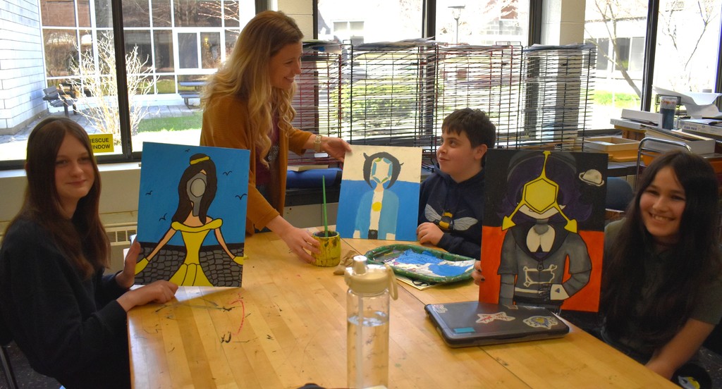 student and teacher in art class