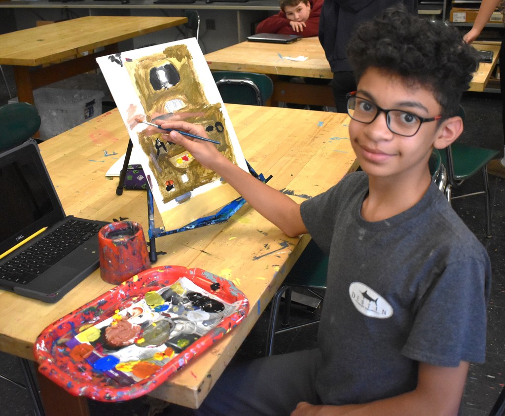 student in art class