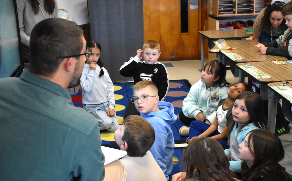 students and  teacher in class