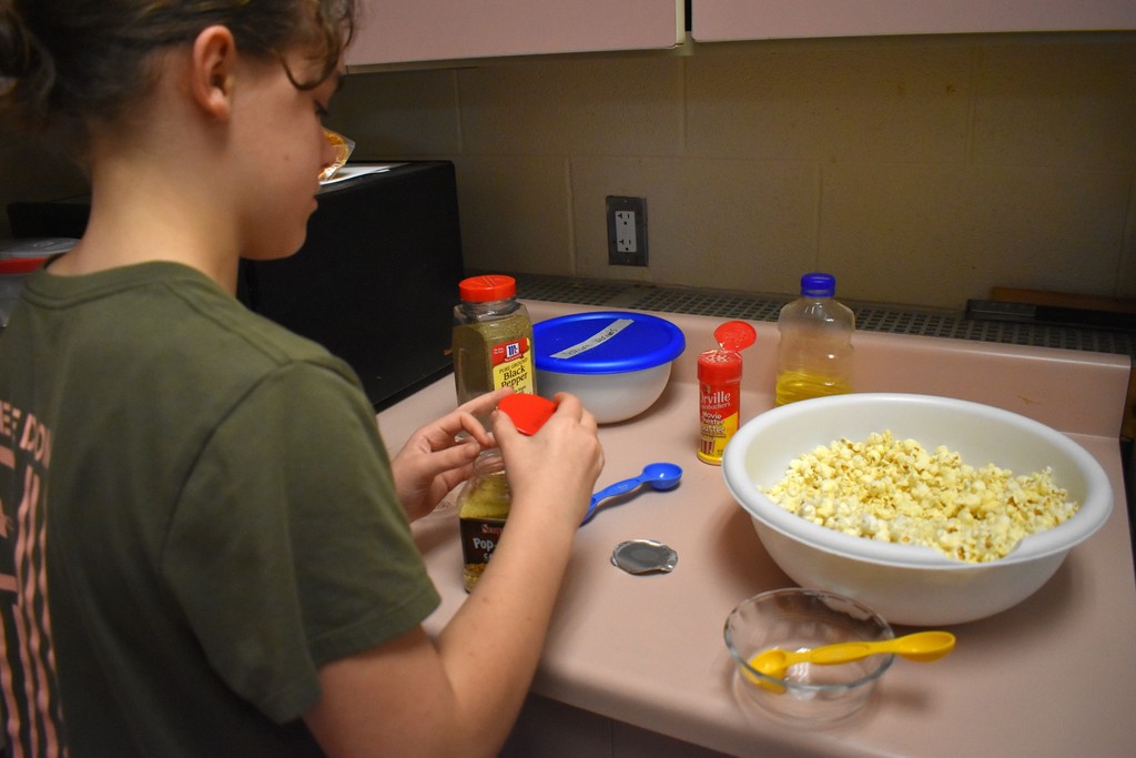 student with popcorn