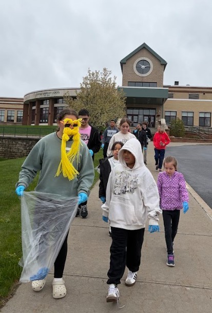 students cleaning park