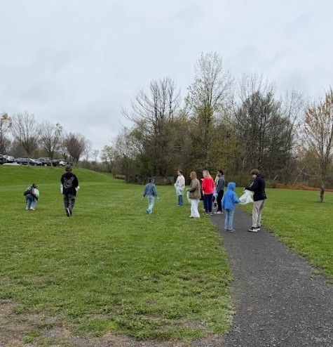 students cleaning park