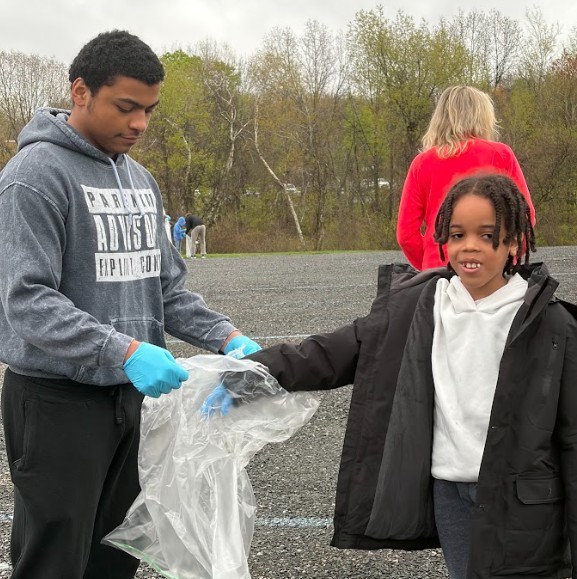 students cleaning park