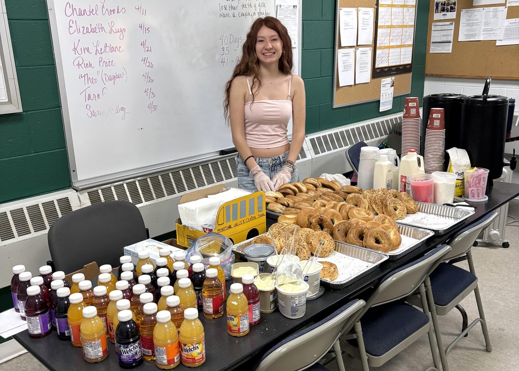 student with breakfast items