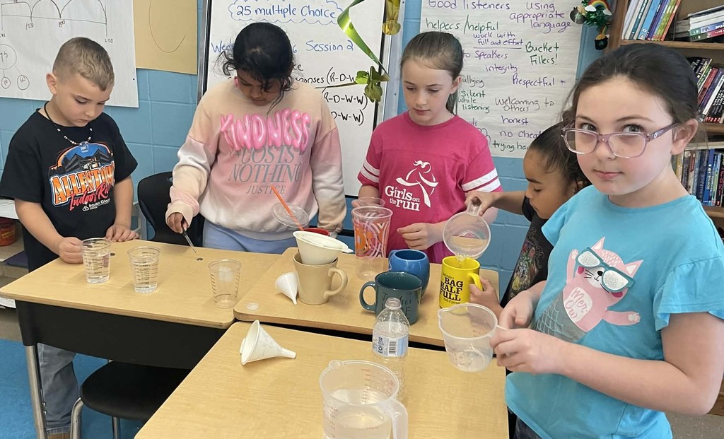 students measuring items