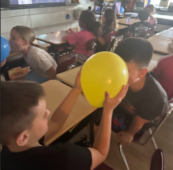 students with balloons
