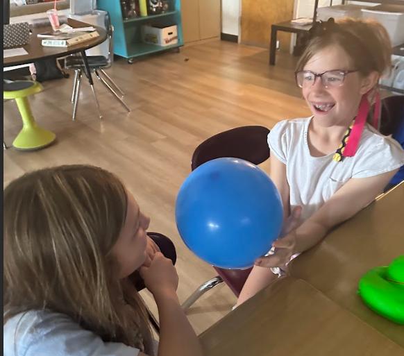 students with balloons