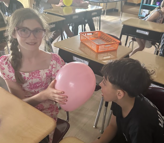students with balloons
