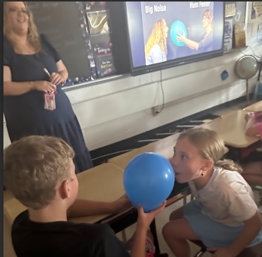 students with balloons