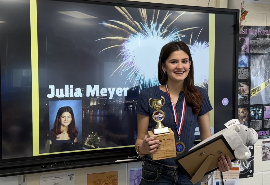 student with trophy