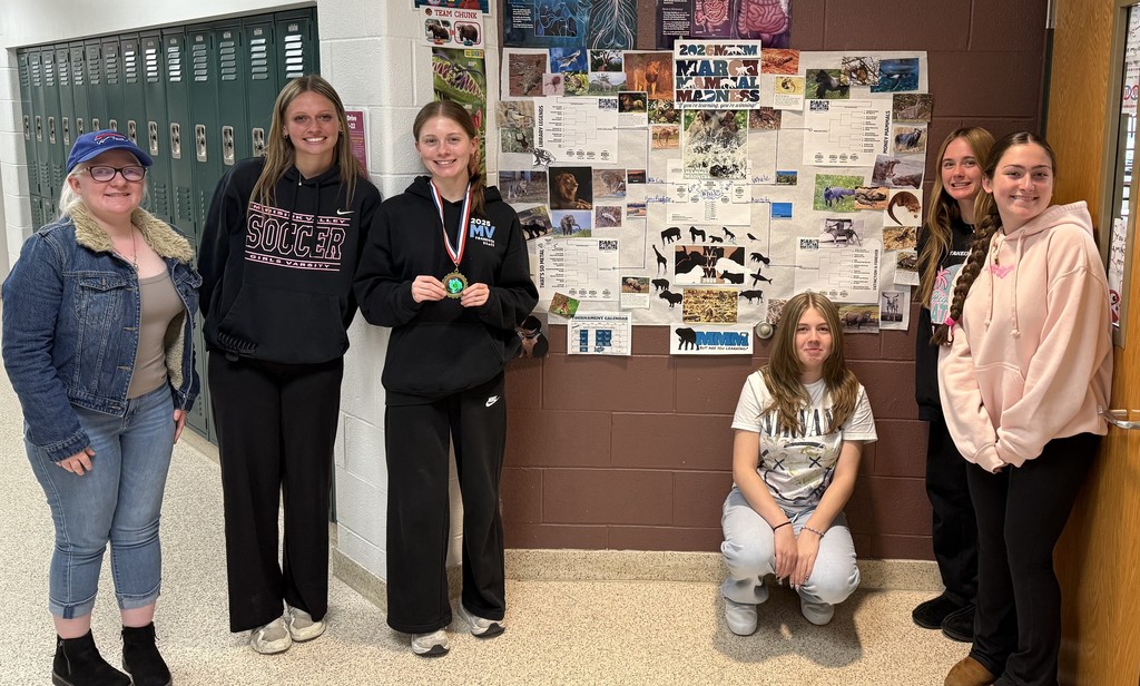 students by a bulletin board