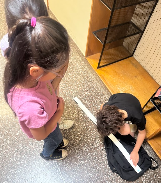 students with measurement tools