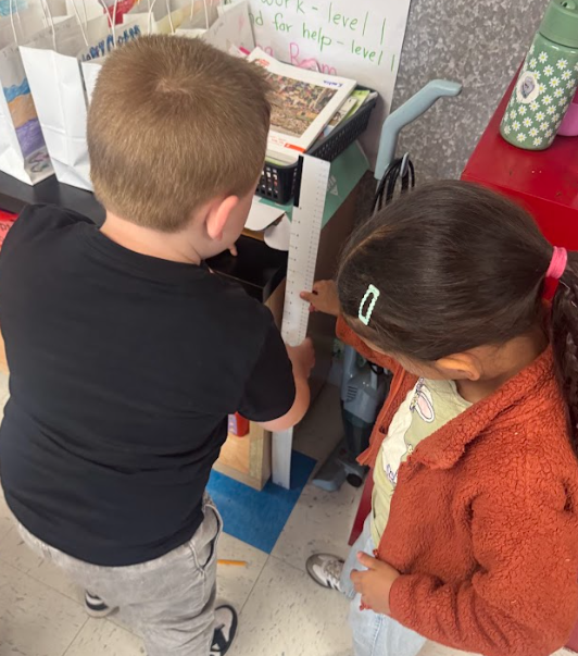 students with measurement tools
