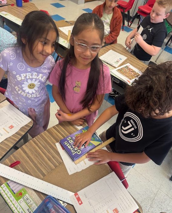 students with measurement tools