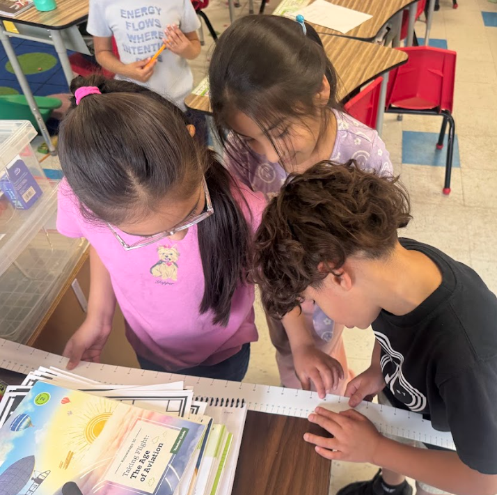 students with measurement tools