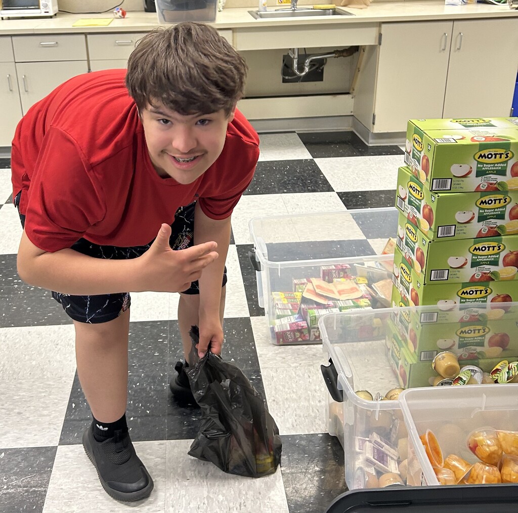 student with collected food