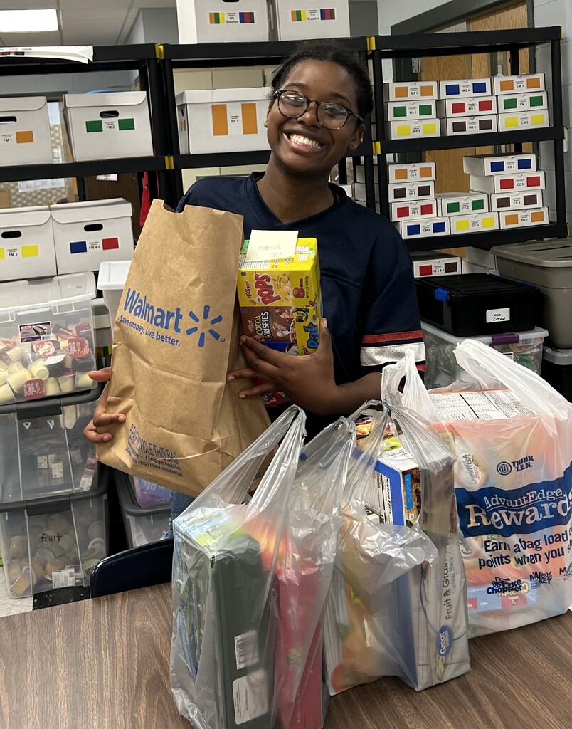 student with collected food