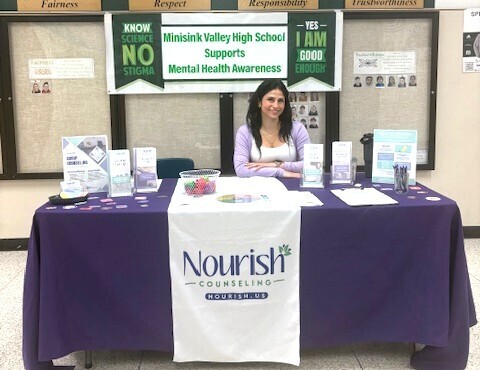 counselor at information table